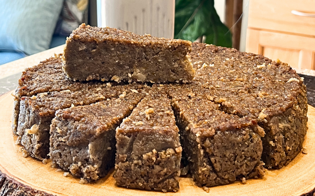 Authentic Virgin Islands Sweet Potato Pudding with rum glaze, coconut, pumpkin, and warm Caribbean spices by Chef Winston