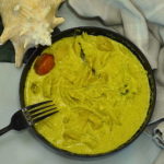 Coconut Curry Conch by Chef Winston served in a creamy coconut curry sauce with fresh herbs and island spices