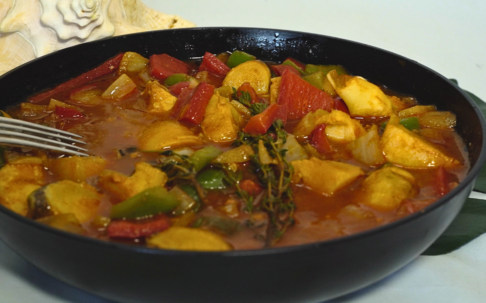 Conch Creole by Chef Winston featuring tender conch in a rich Caribbean Creole sauce with peppers, herbs, and island spices