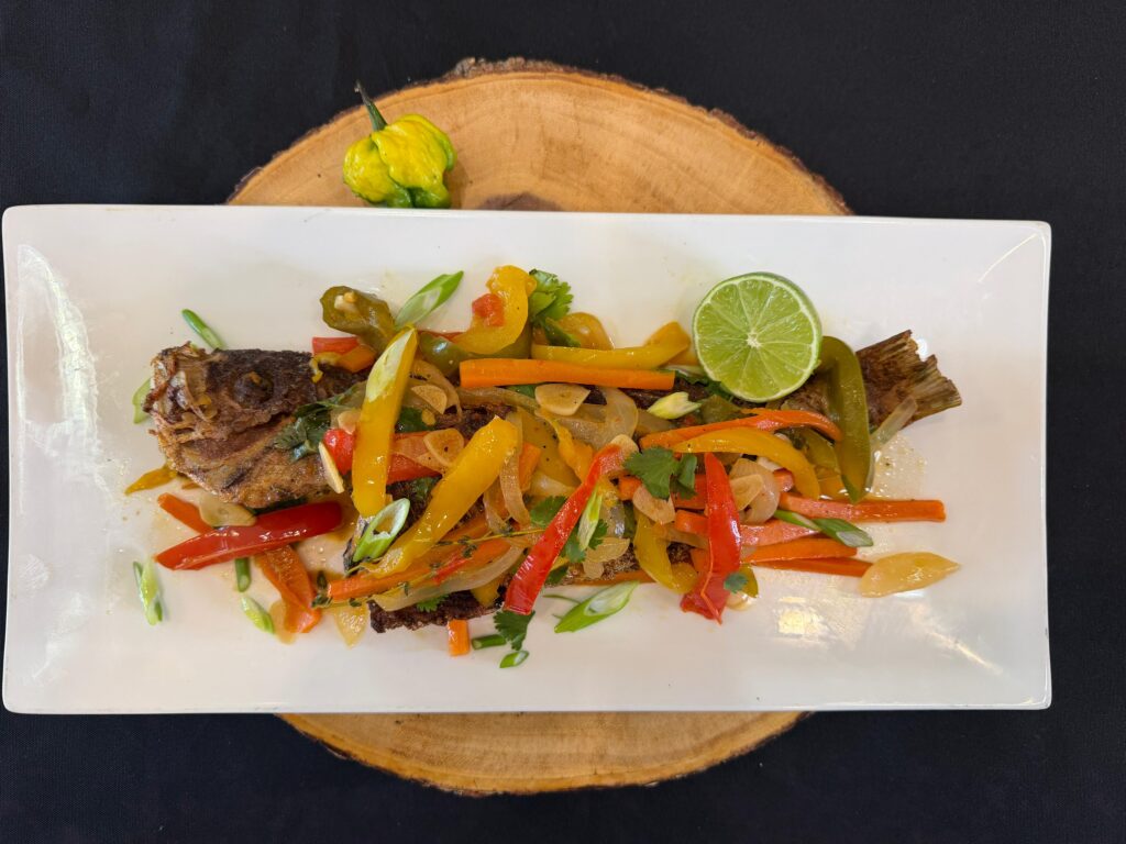 Escovitch Fish Floribbean Style Recipe by Chef Winston featuring crispy whole snapper topped with colorful citrus escovitch vegetables