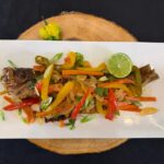 Escovitch Fish Floribbean Style Recipe by Chef Winston featuring crispy whole snapper topped with colorful citrus escovitch vegetables