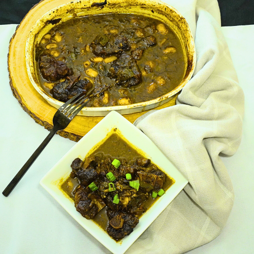 Braised Oxtail with Butter Beans by Chef Winston served with rich gravy and Caribbean-inspired sides